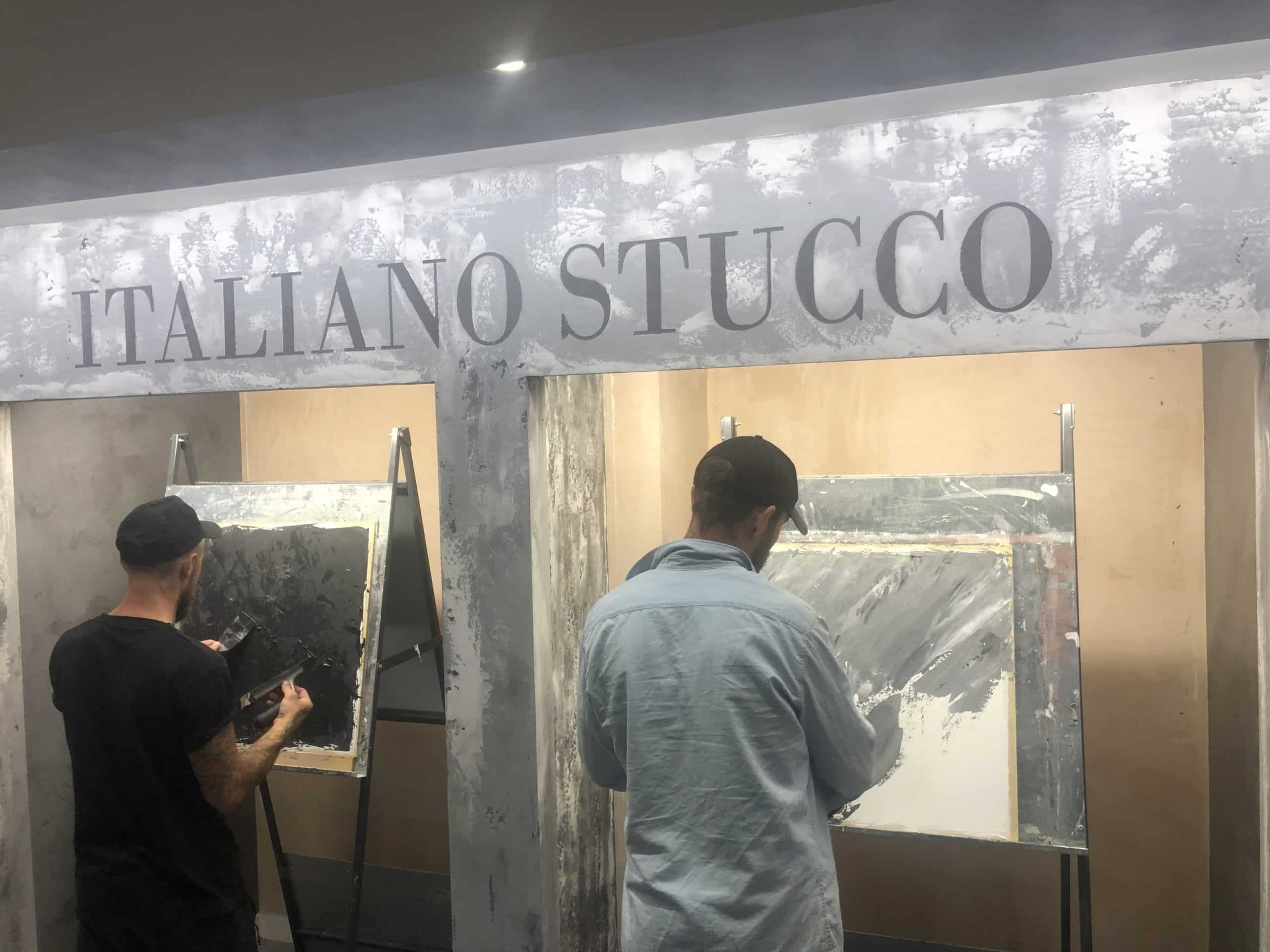 two students apply the teaching during their Venetian plastering course