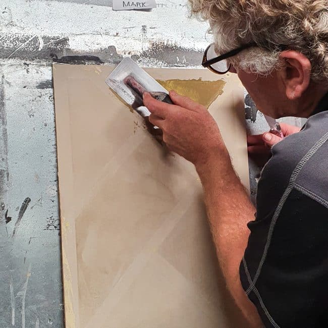 a course trainee applies delicate skill during his Venetian plastering course